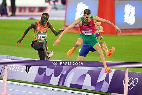 Soufiane El Bakkali, Kenneth Rooks and Abraham Kibiwot competes in the men's 3000-meters steeplechase final